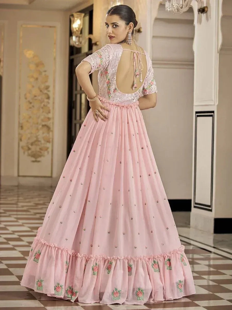 Pink floral embroidered lehenga choli with open back, perfect for Indian weddings and festive occasions