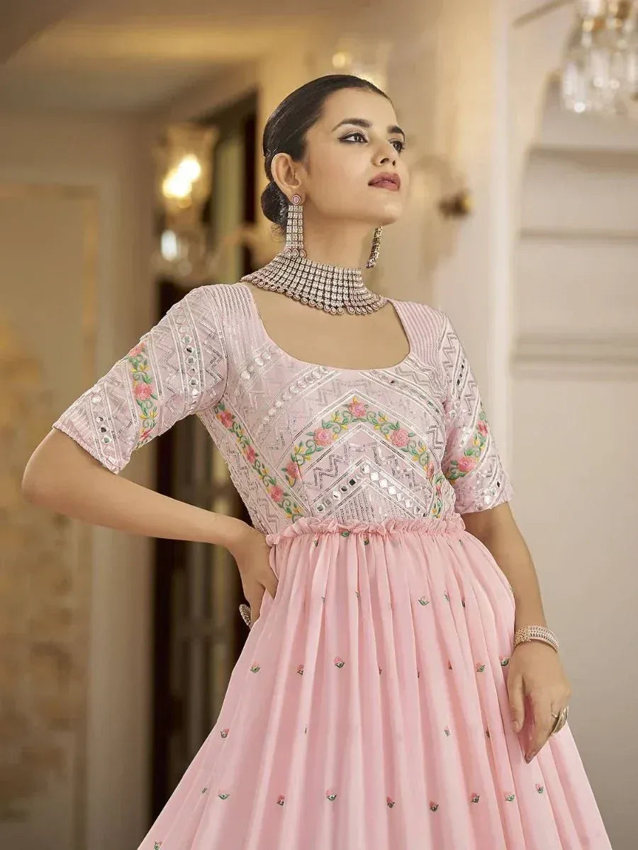 Pink embroidered ethnic gown with floral mirror work, perfect for Indian weddings and parties