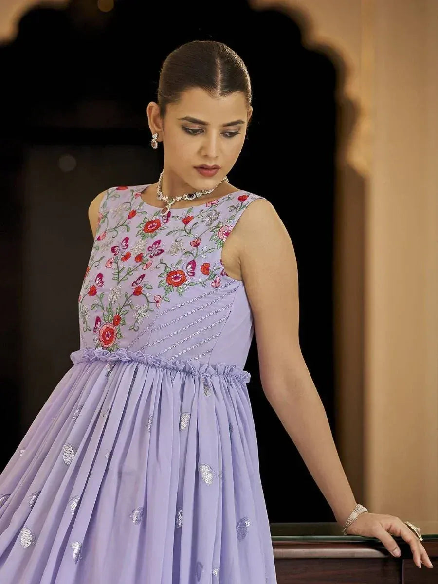 Lavender ethnic gown with floral embroidery and sequin details, perfect for Indian occasions