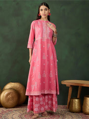 Woman wearing pink printed Indian ethnic salwar kameez, styled with traditional jewelry, Ethnic Plus
