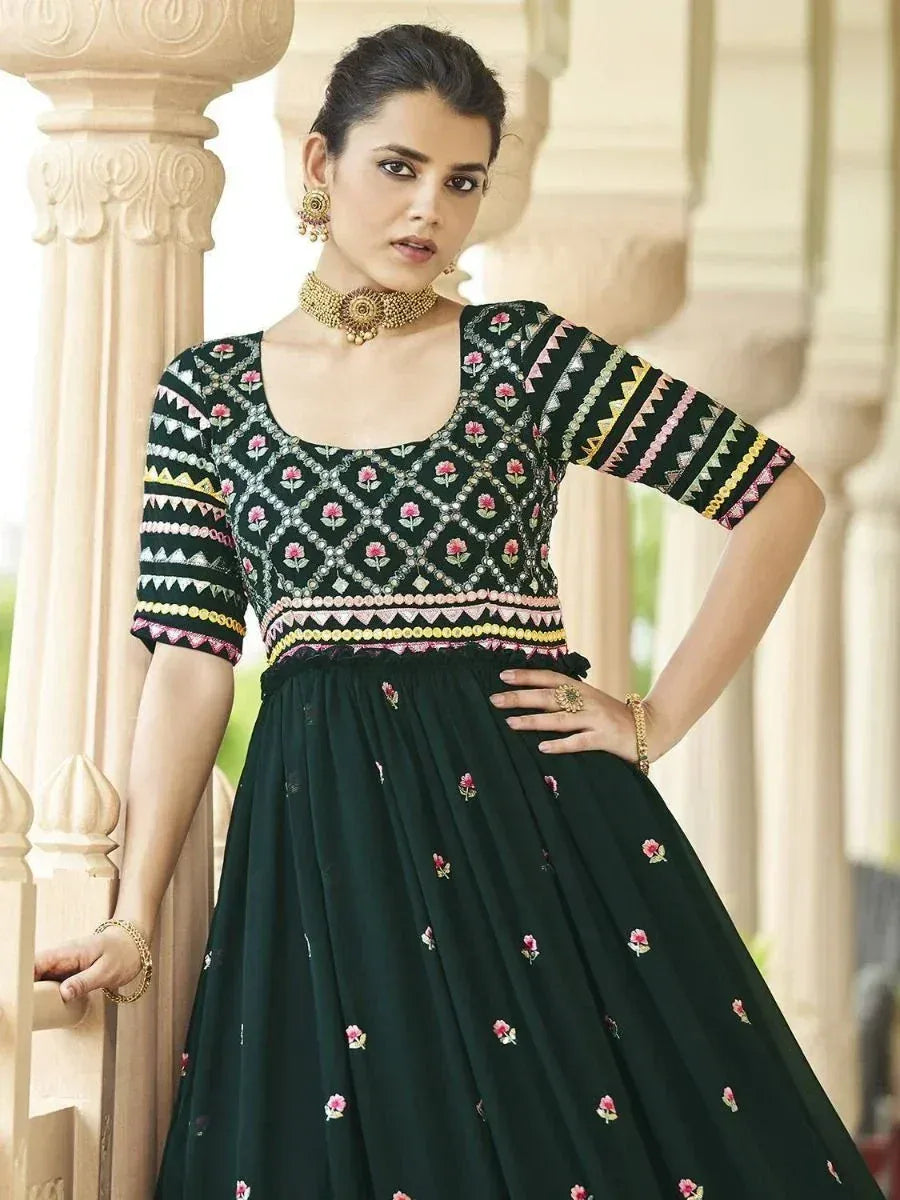 Black embroidered ethnic gown with floral motifs and colorful geometric patterns, perfect for Indian occasions.