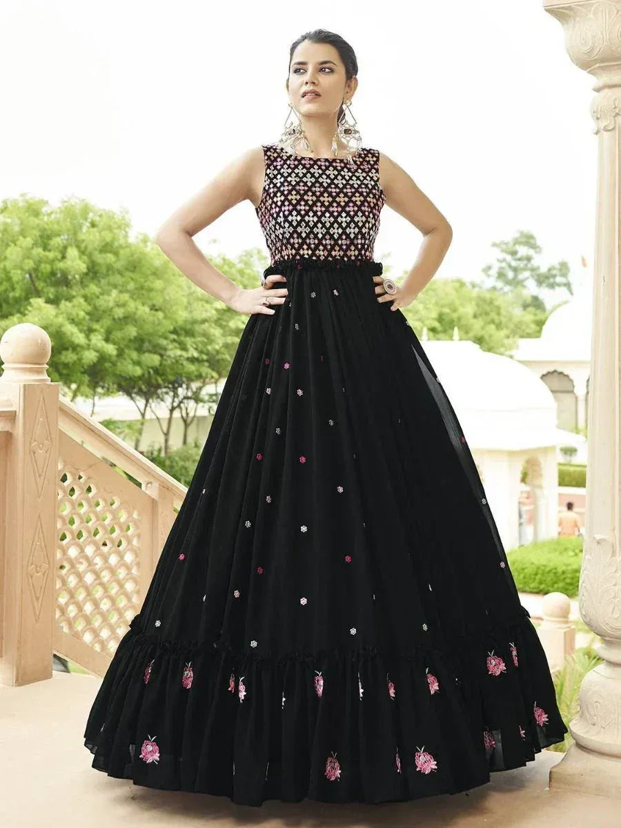 Black embroidered ethnic gown with floral details, perfect for Indian weddings and festive occasions.