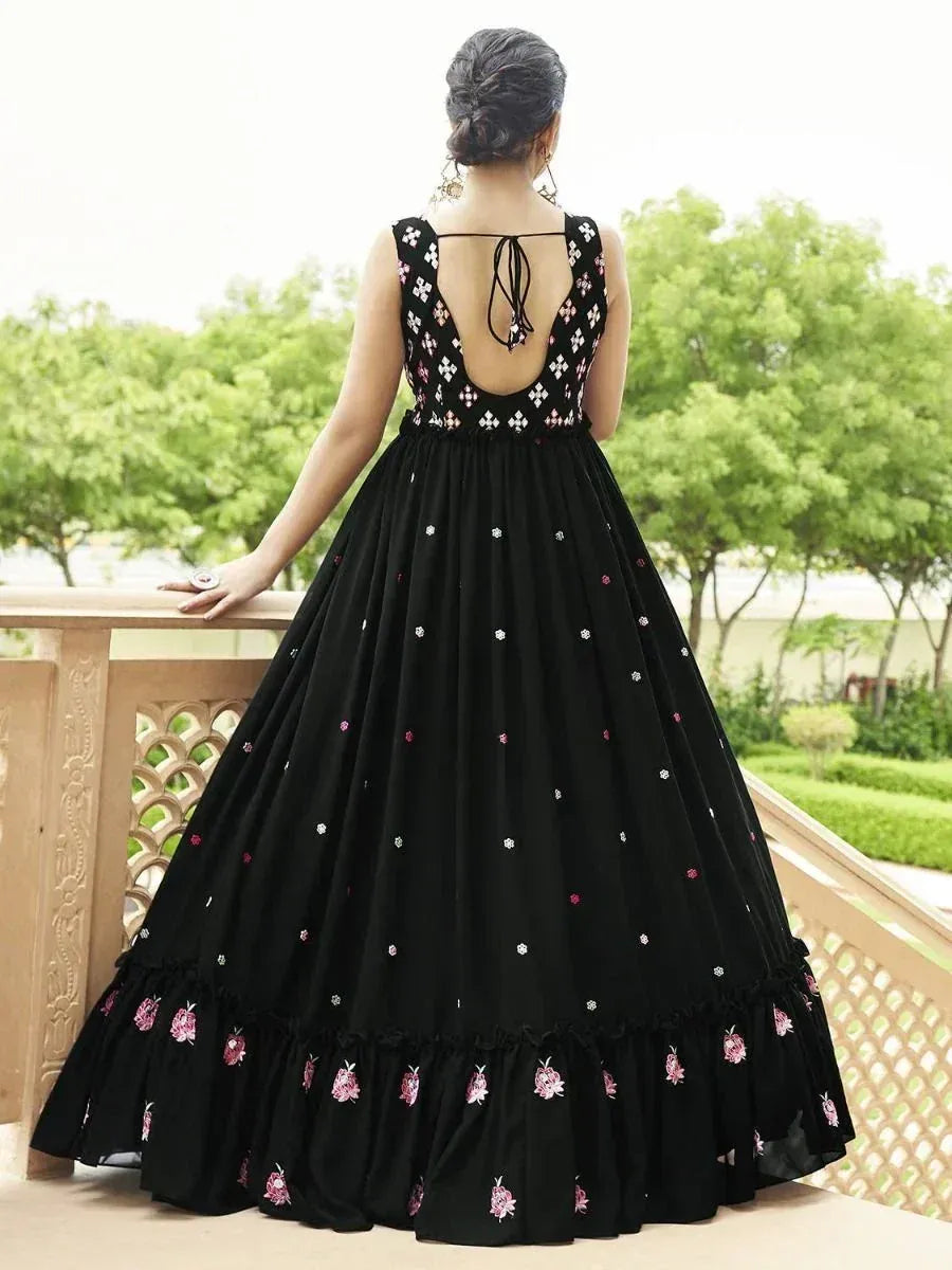 Black embroidered ethnic gown with floral details and open back, perfect for Indian festive occasions
