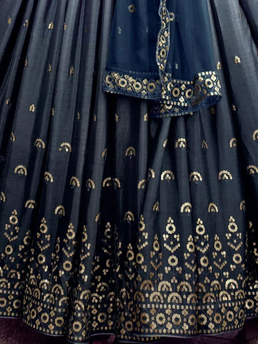 Dark blue lehenga choli with gold embroidery and sequin detailing, ethnic Indian wear