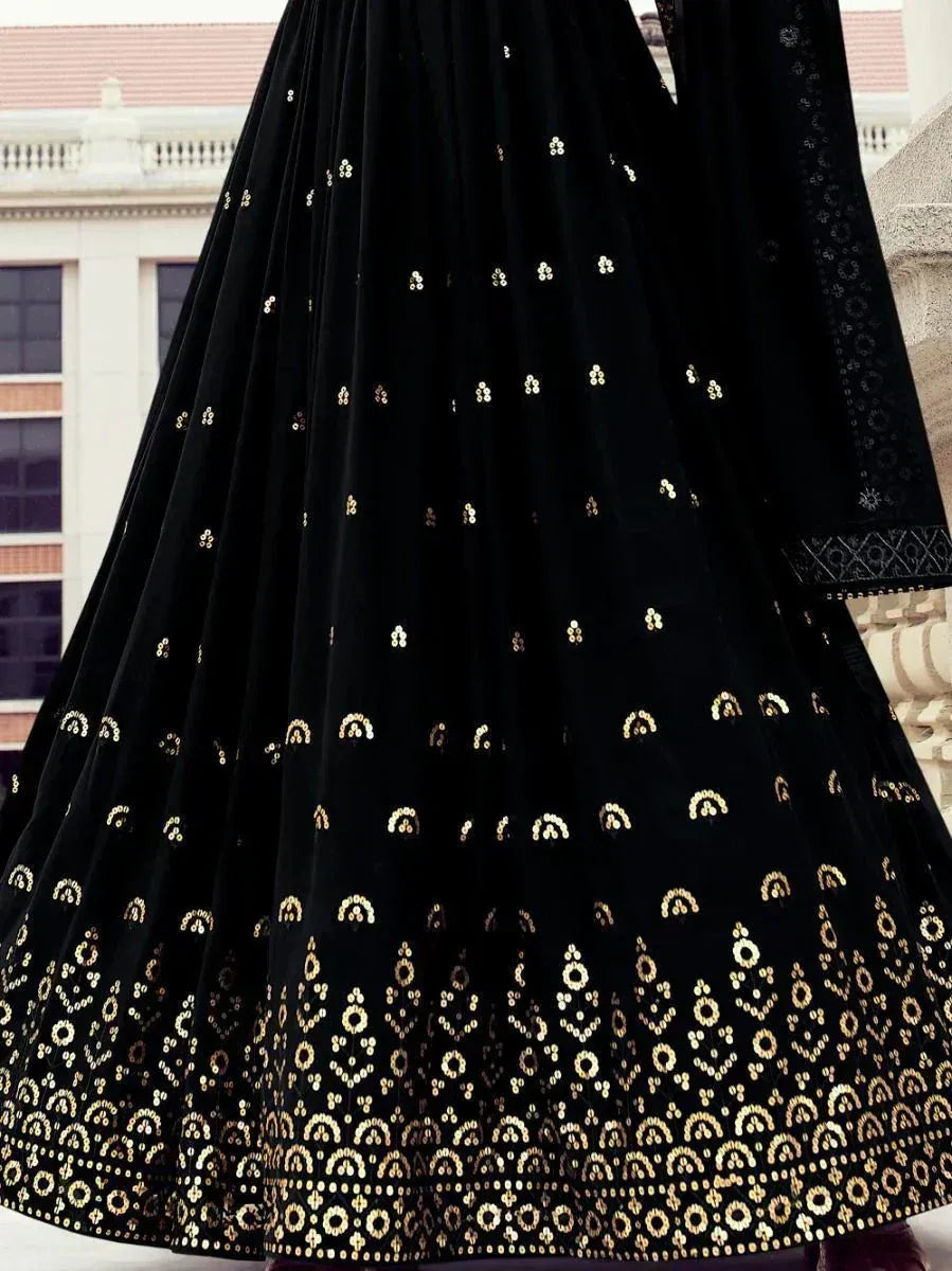 Black velvet lehenga with gold embroidery, ethnic Indian wear for festive occasions