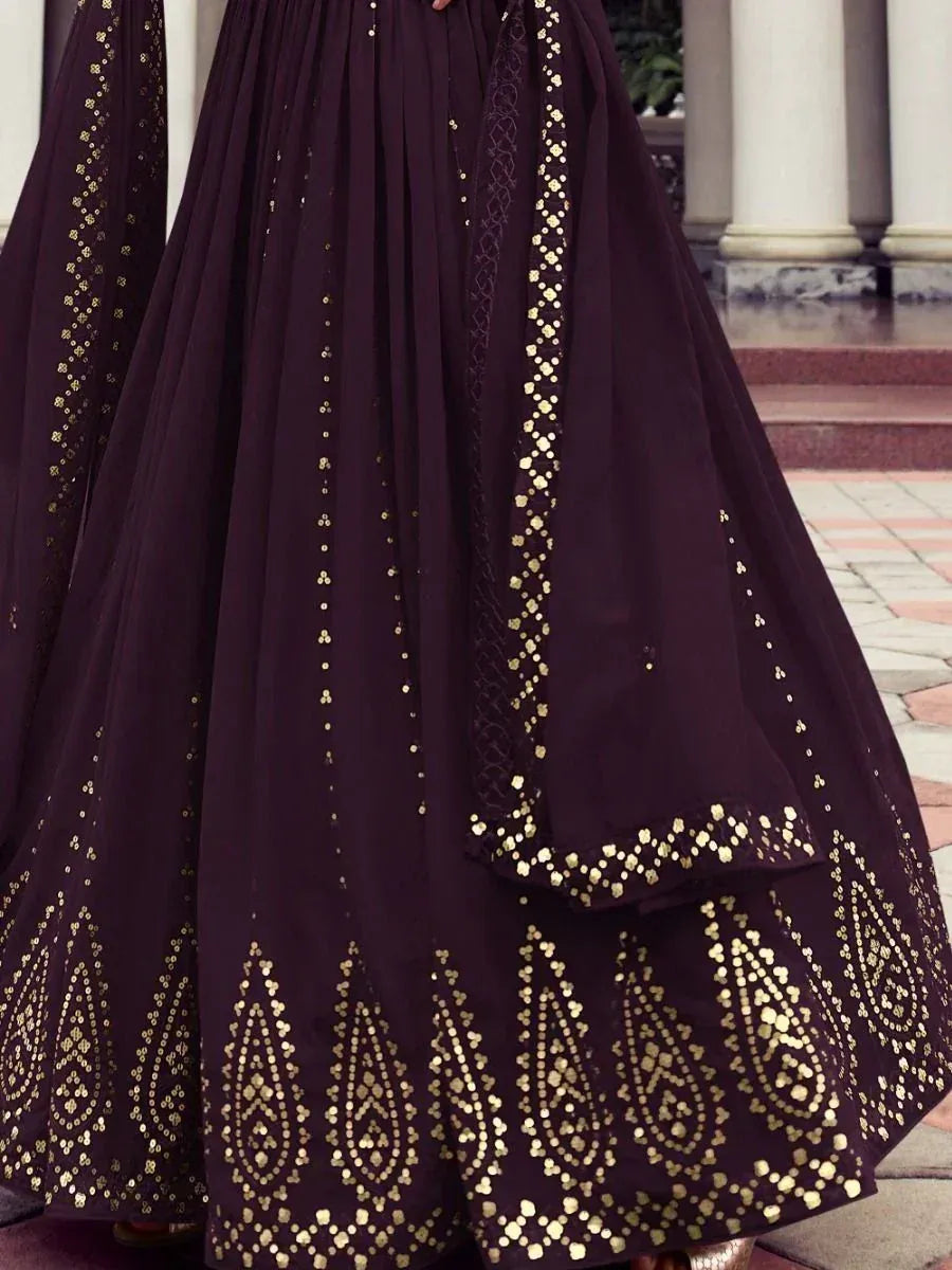Dark purple lehenga with gold embroidery, perfect for Indian ethnic wear and festive occasions.