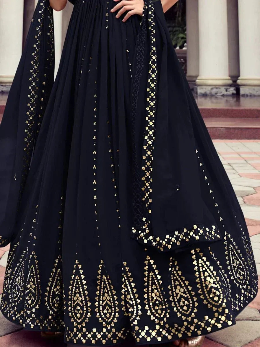 Black ethnic gown with gold sequin embroidery and traditional Indian patterns