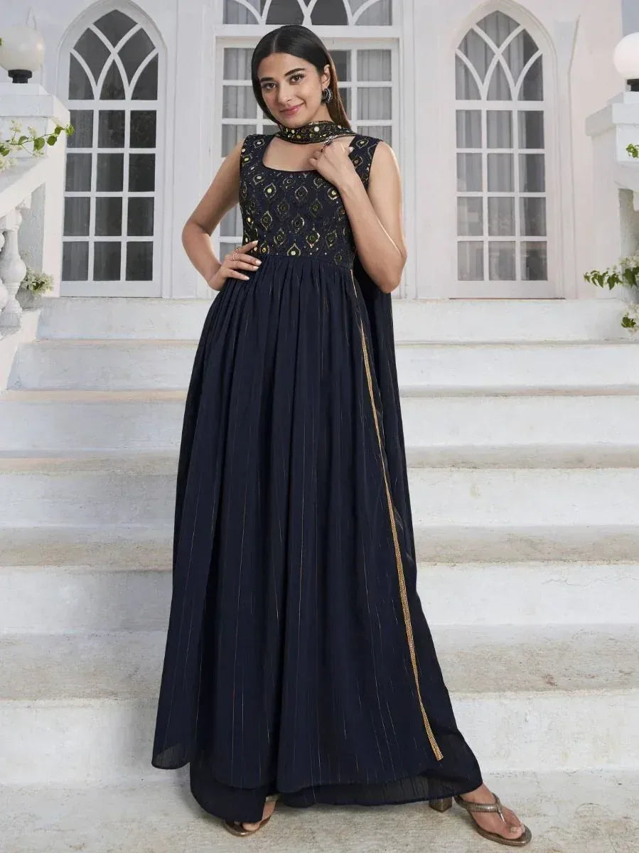 Navy blue ethnic gown with gold embroidery, perfect for Indian occasions and festive wear.