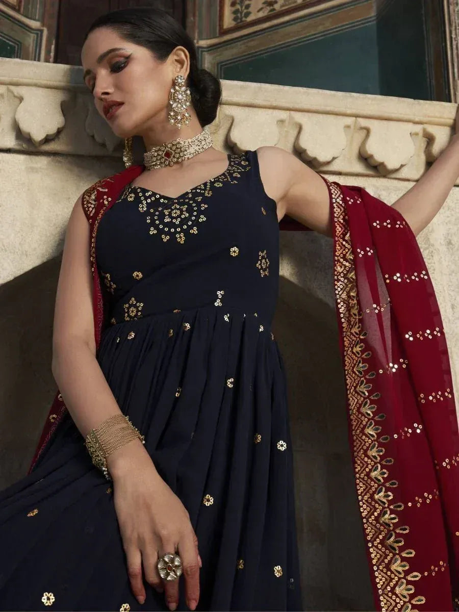 Navy blue embroidered anarkali with red dupatta, gold jewelry, ethnic Indian wear
