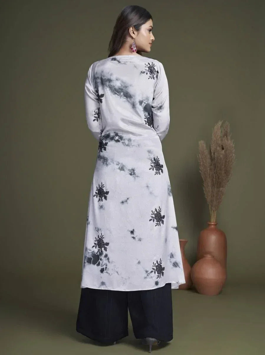 White tie-dye kurta with black floral embroidery, paired with black palazzo pants, ethnic wear