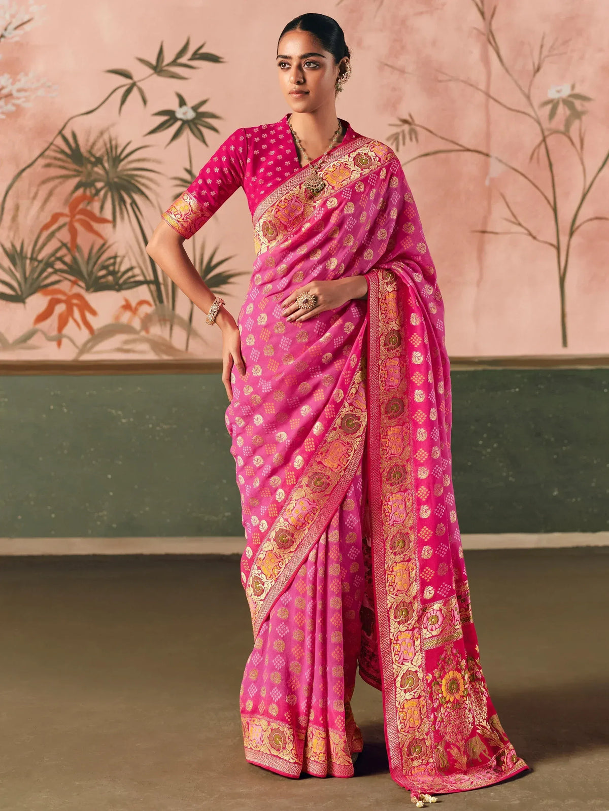 Pink designer saree with gold embroidery, perfect for ethnic wear occasions