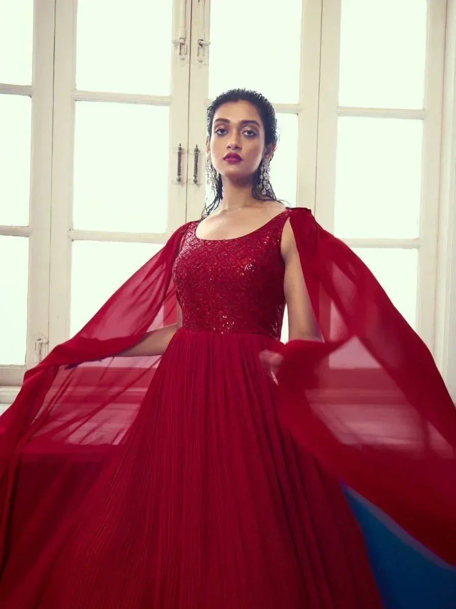 Red sequin ethnic gown with flowing cape, perfect for Indian weddings and festive occasions