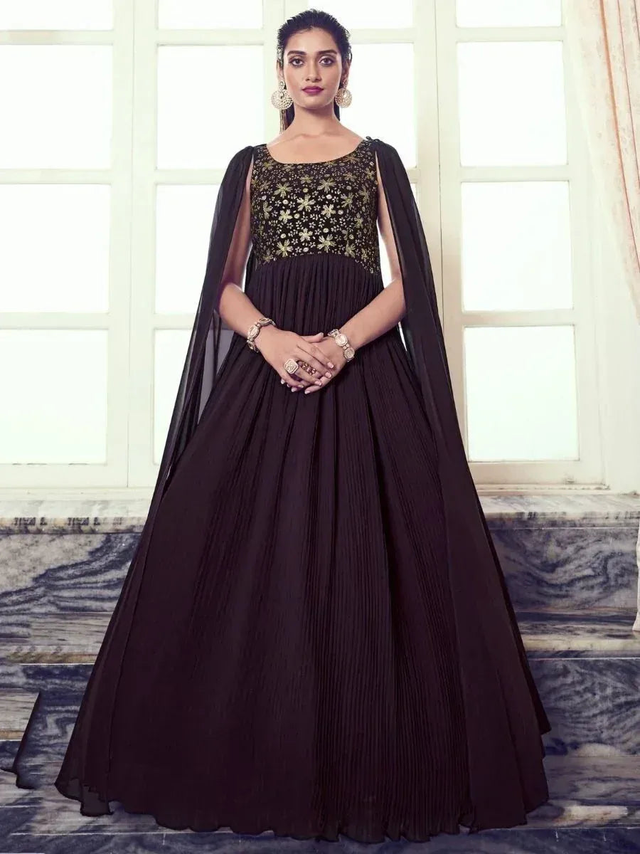 Black ethnic gown with gold floral embroidery and cape sleeves, perfect for Indian occasions