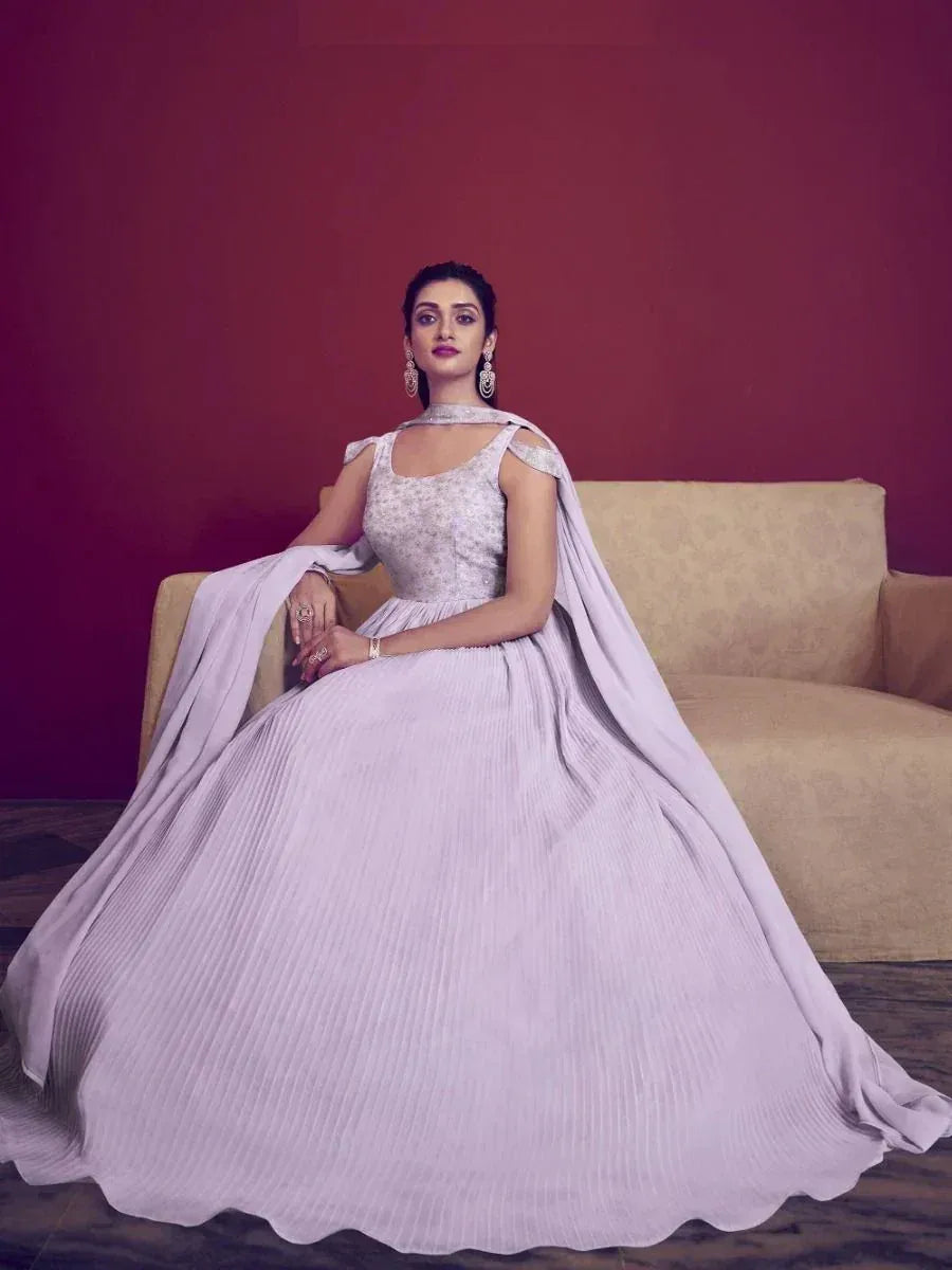 Lavender ethnic gown with cape, pleated skirt, and embellished bodice for Indian occasions