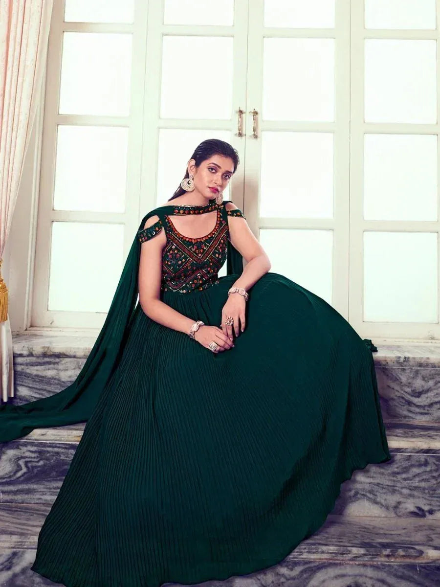 Emerald green ethnic gown with embroidered bodice and pleated skirt, perfect for Indian occasions