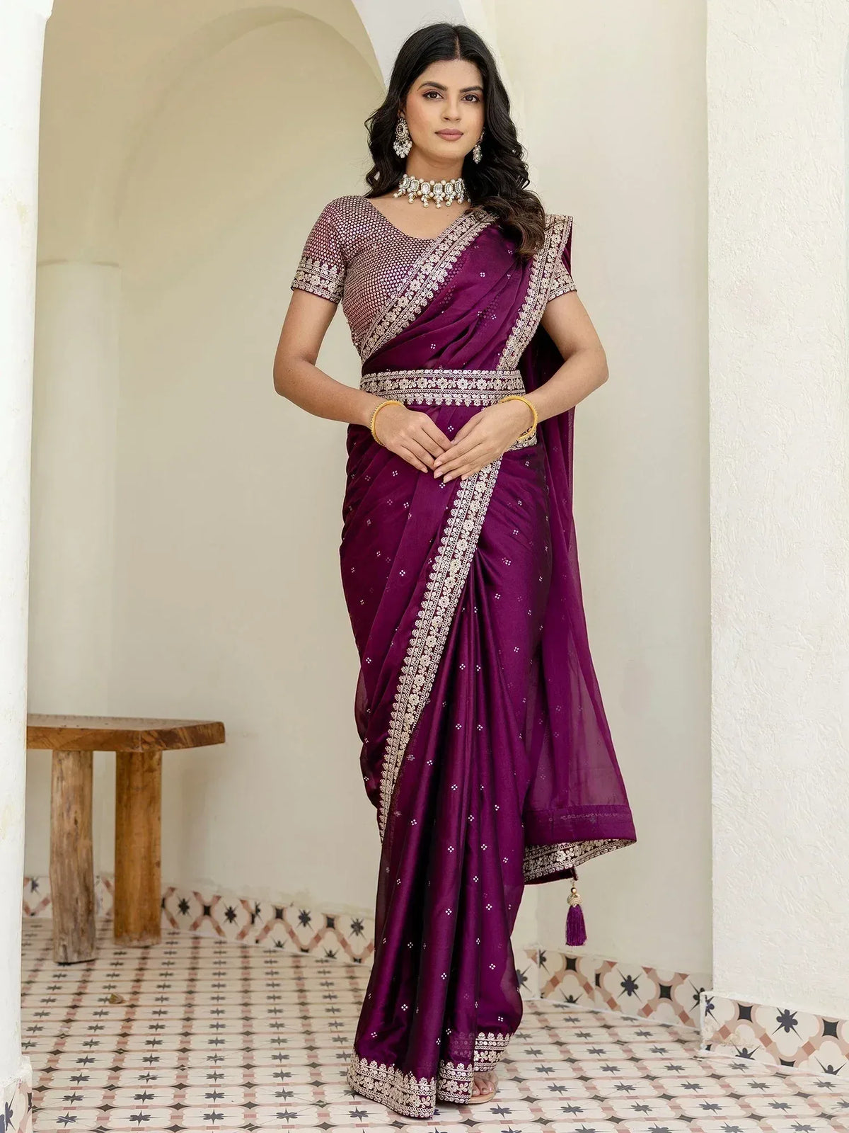 Elegant purple saree with gold embroidery, perfect for Indian ethnic wear and festive occasions.