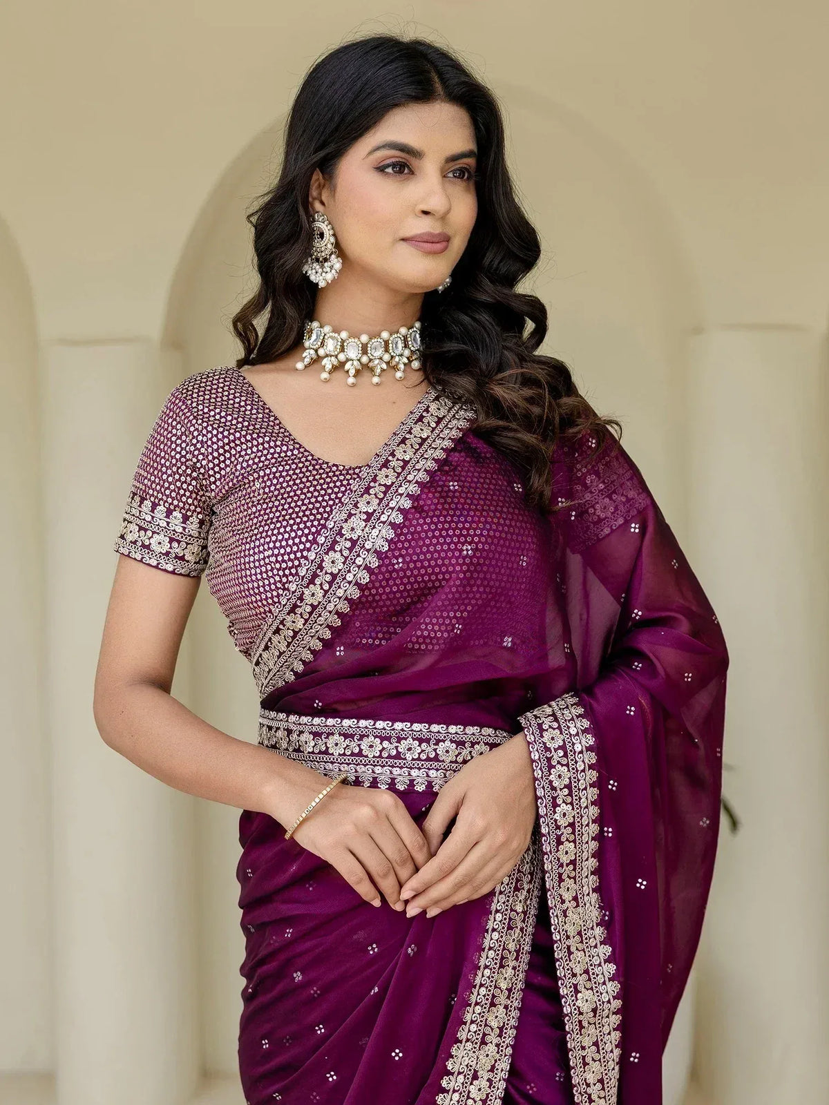 Purple designer saree with gold embroidery and sequins, perfect for Indian ethnic wear occasions