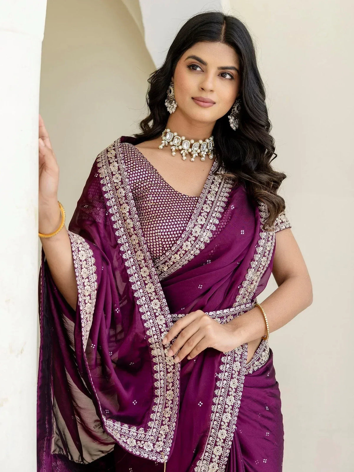 Elegant purple saree with gold embroidery, perfect for Indian ethnic wear and festive occasions.