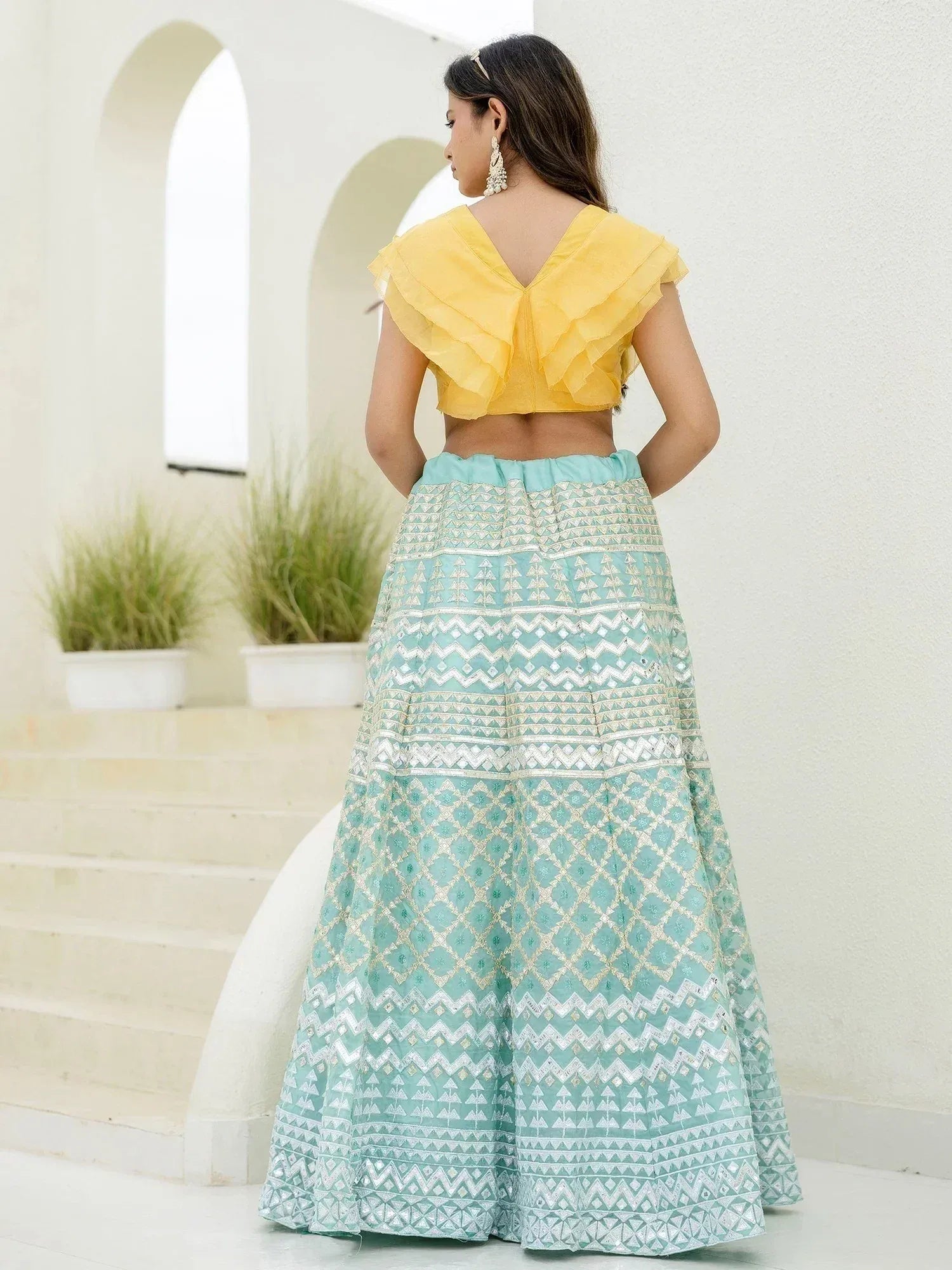 Yellow ruffle blouse with mint green embroidered lehenga, ethnic Indian wear for women