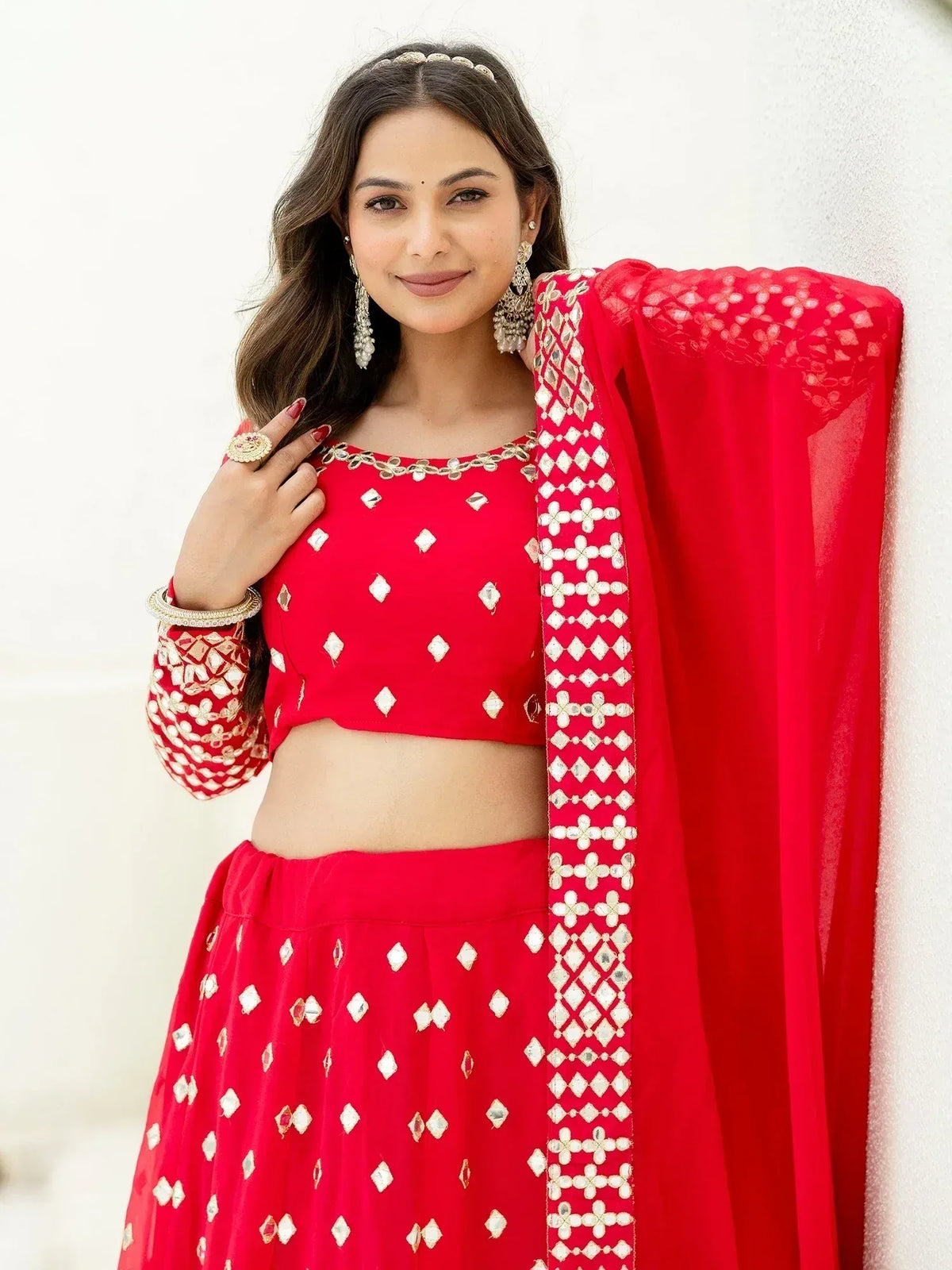 Red designer lehenga choli with mirror work and dupatta, perfect for Indian ethnic wear occasions