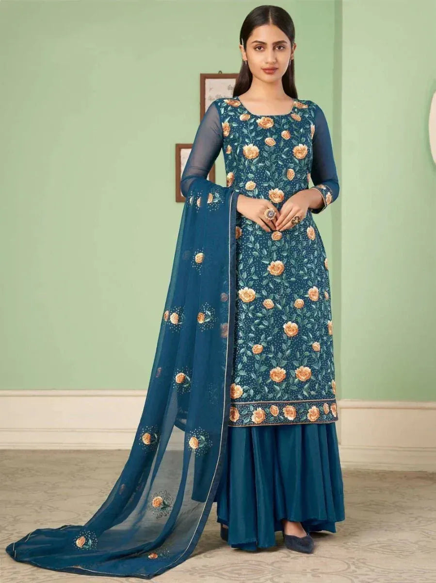 Teal floral embroidered salwar kameez with sheer sleeves and matching dupatta, ideal for ethnic occasions