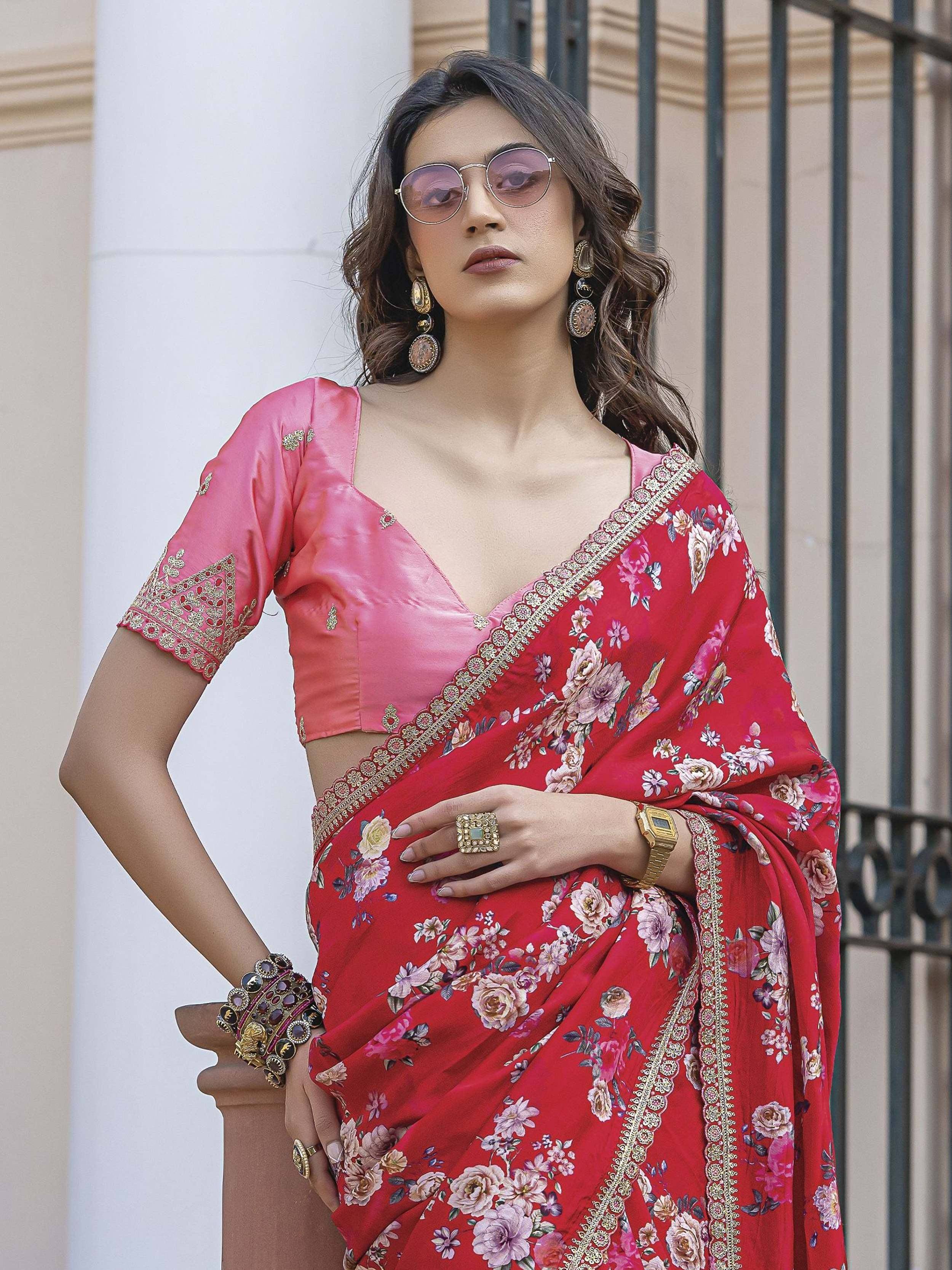 Red floral saree with pink blouse, gold embroidery, and statement jewelry for Indian ethnic wear