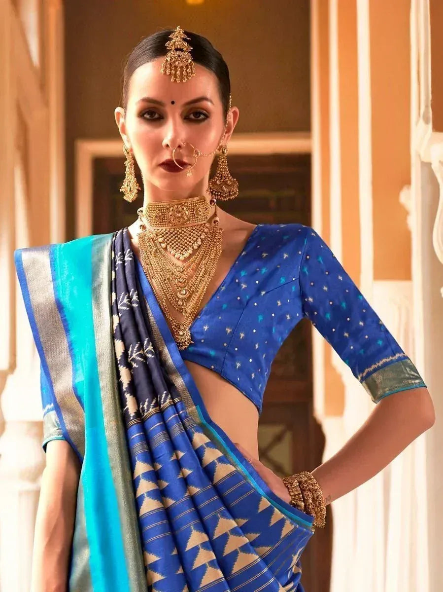 Blue printed saree with gold jewelry, perfect for Indian ethnic wear and festive occasions