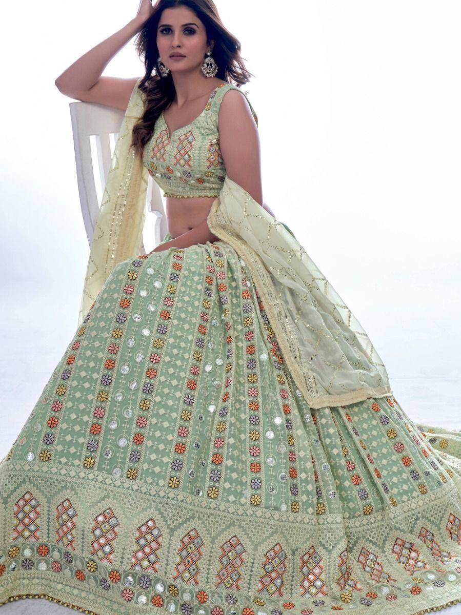 Mint green designer lehenga choli with floral mirror work and dupatta, perfect for Indian ethnic occasions