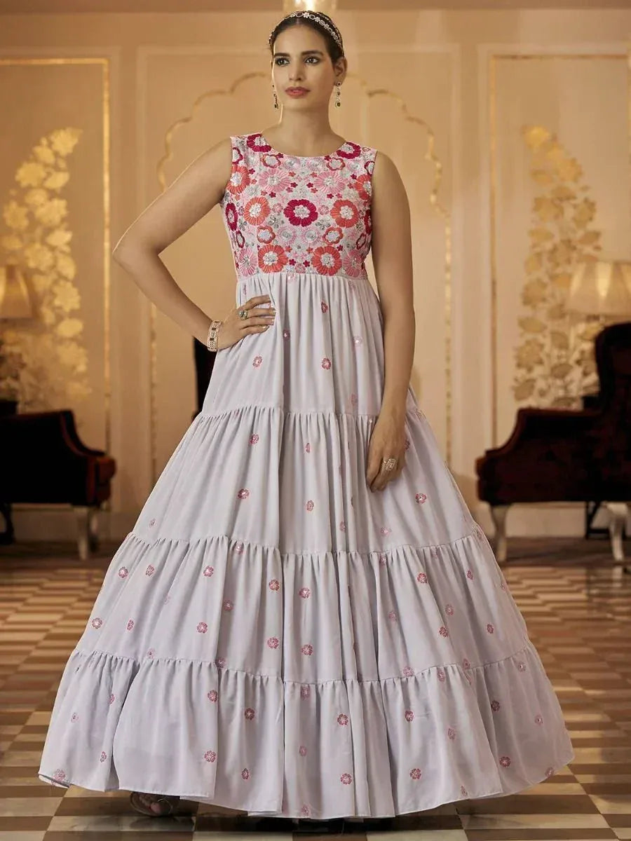 Elegant floral embroidered ethnic gown in light lavender with tiered skirt, perfect for Indian occasions