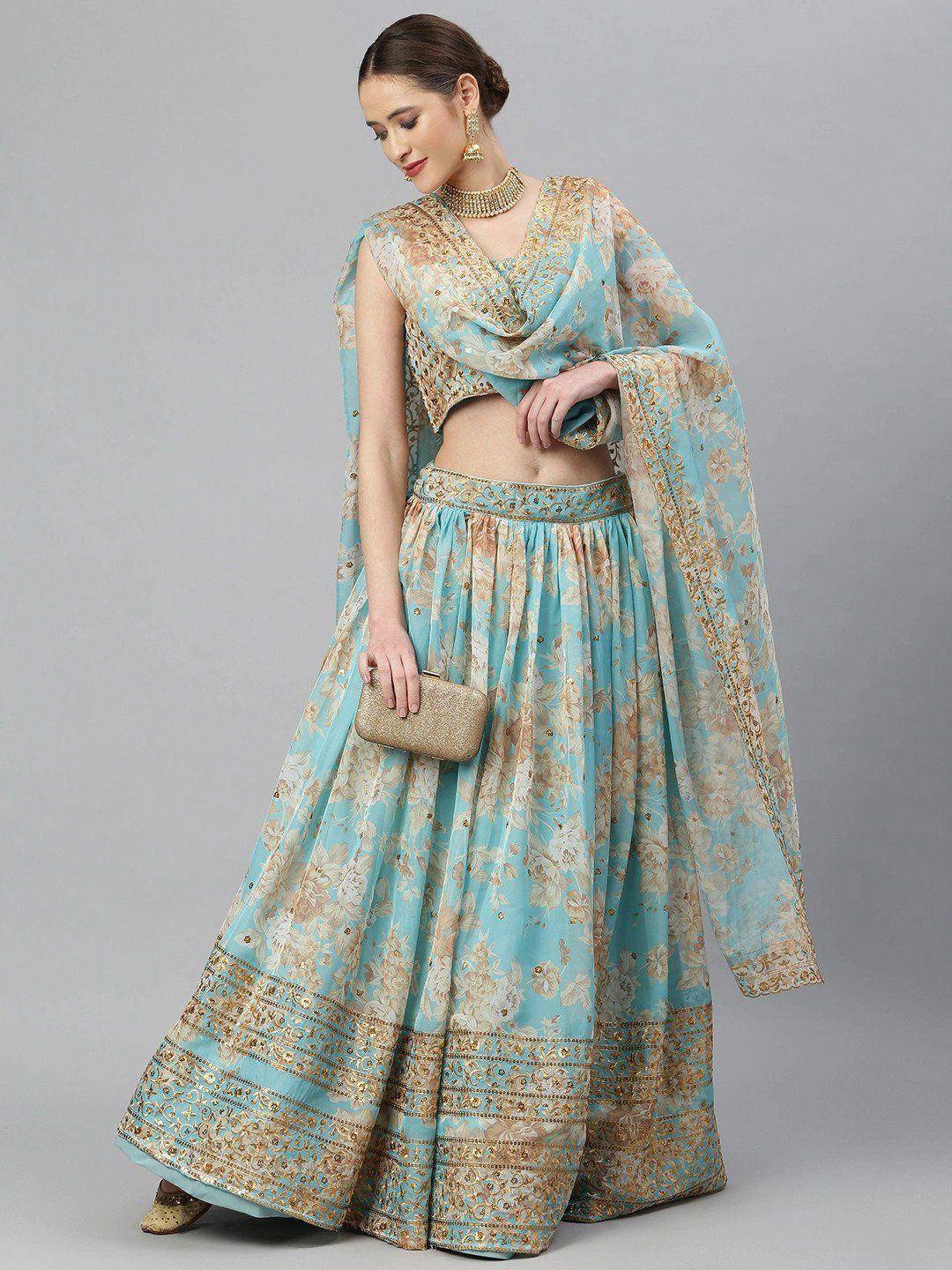 Elegant light blue lehenga choli with gold floral embroidery, perfect for Indian ethnic occasions