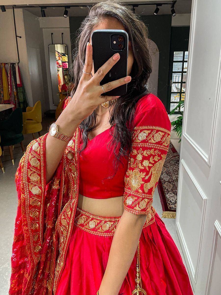 Red embroidered lehenga choli with gold detailing, perfect for Indian ethnic wear and festive occasions
