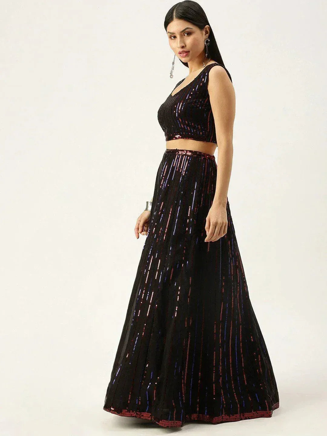 Black sequin lehenga choli with V-neck crop top and flared skirt, perfect for Indian ethnic events