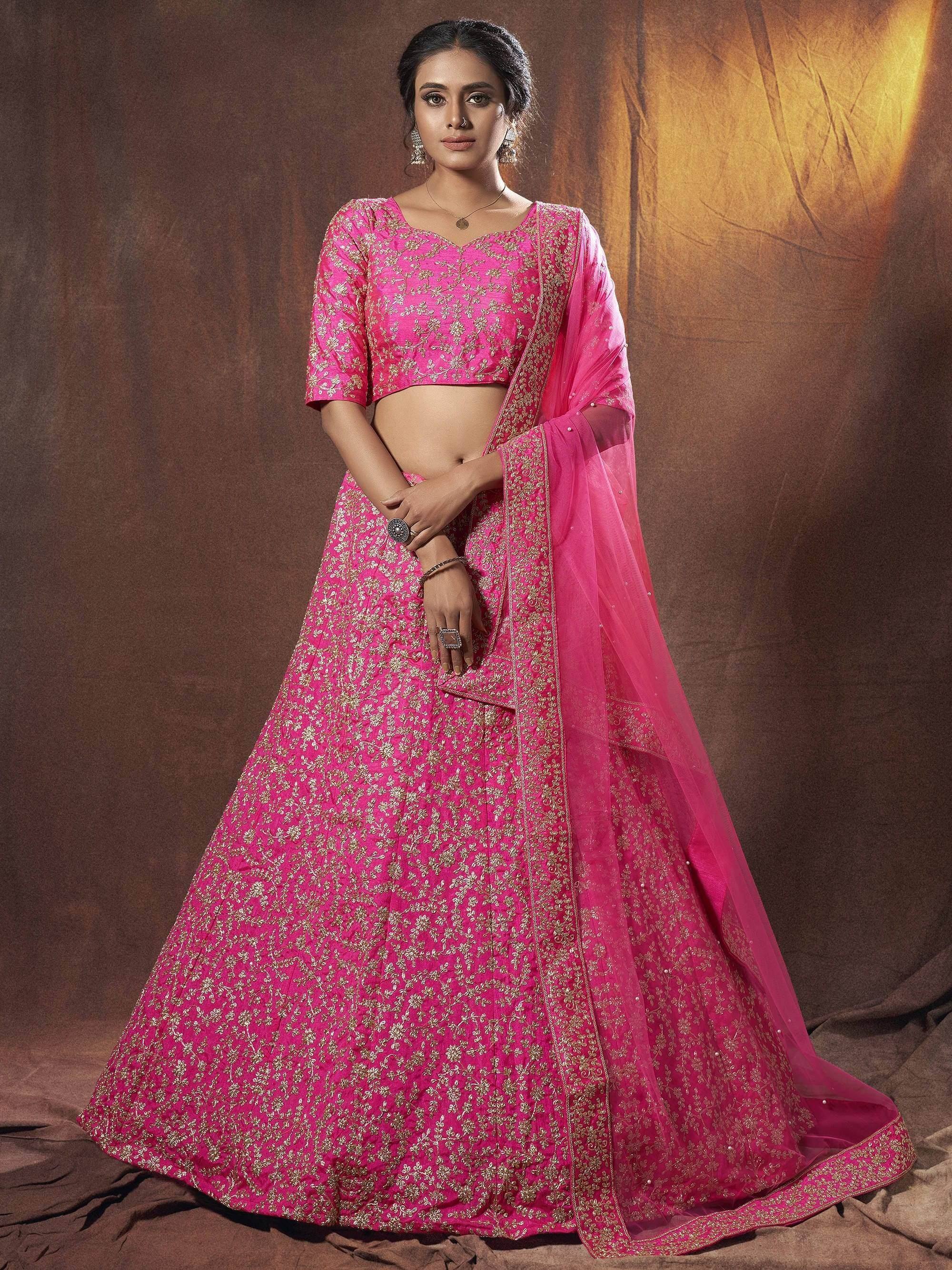 Pink embroidered lehenga choli with gold detailing and matching dupatta for Indian ethnic wear
