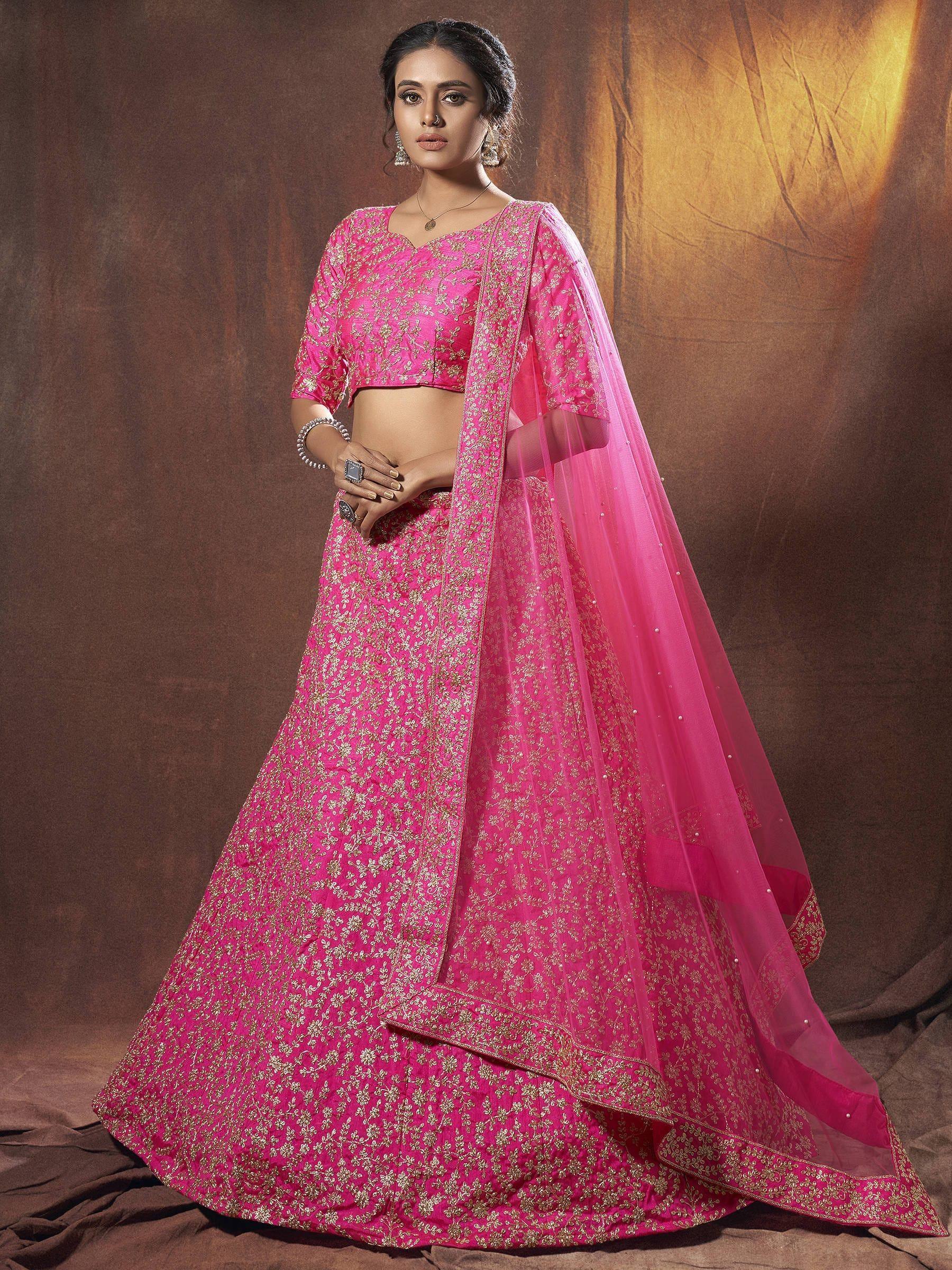 Pink embroidered lehenga choli with gold floral patterns and sheer dupatta, perfect for Indian ethnic wear occasions.