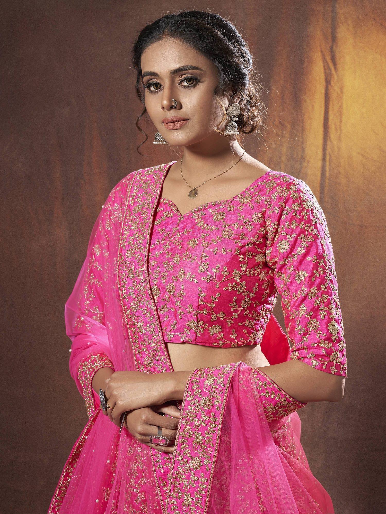 Pink embroidered lehenga choli with gold floral work, perfect for Indian ethnic wear and festive occasions.