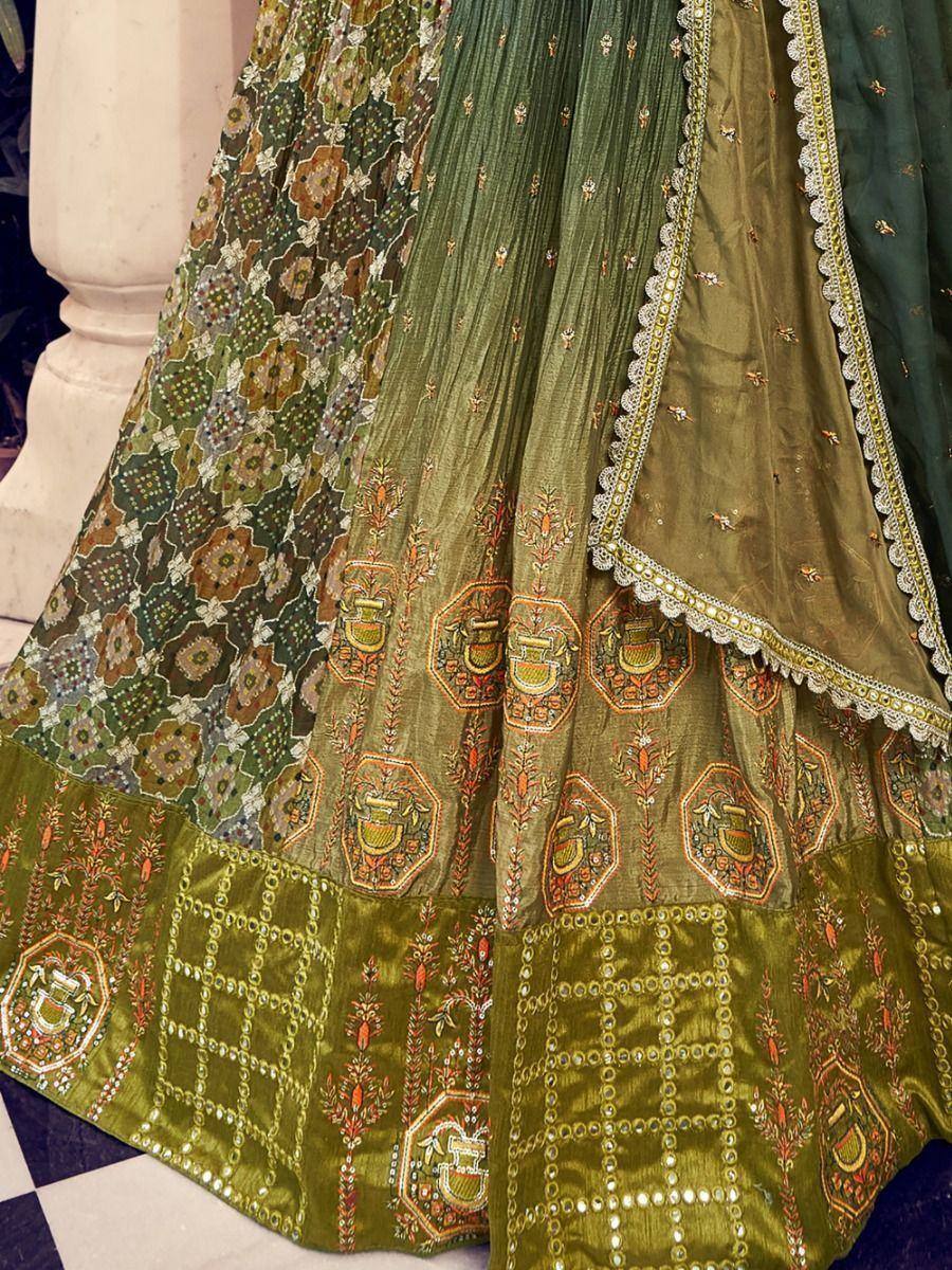 Green embroidered lehenga choli with floral and geometric patterns, perfect for Indian ethnic wear occasions.