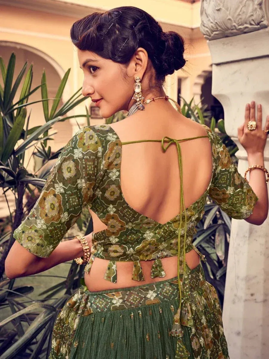 Green floral lehenga choli with open back and tie-up detail, ethnic Indian wear