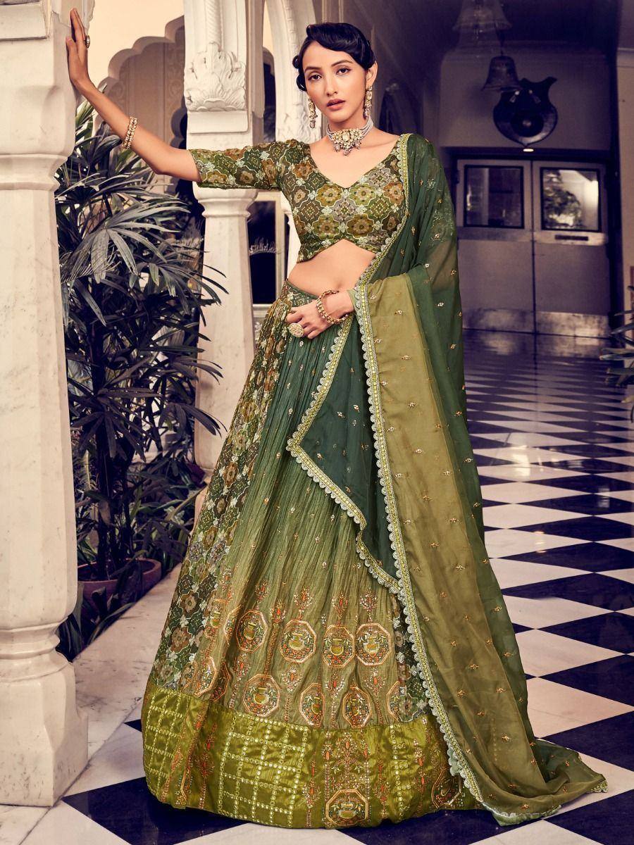 Green embroidered lehenga choli with floral motifs, perfect for Indian weddings and festive occasions.