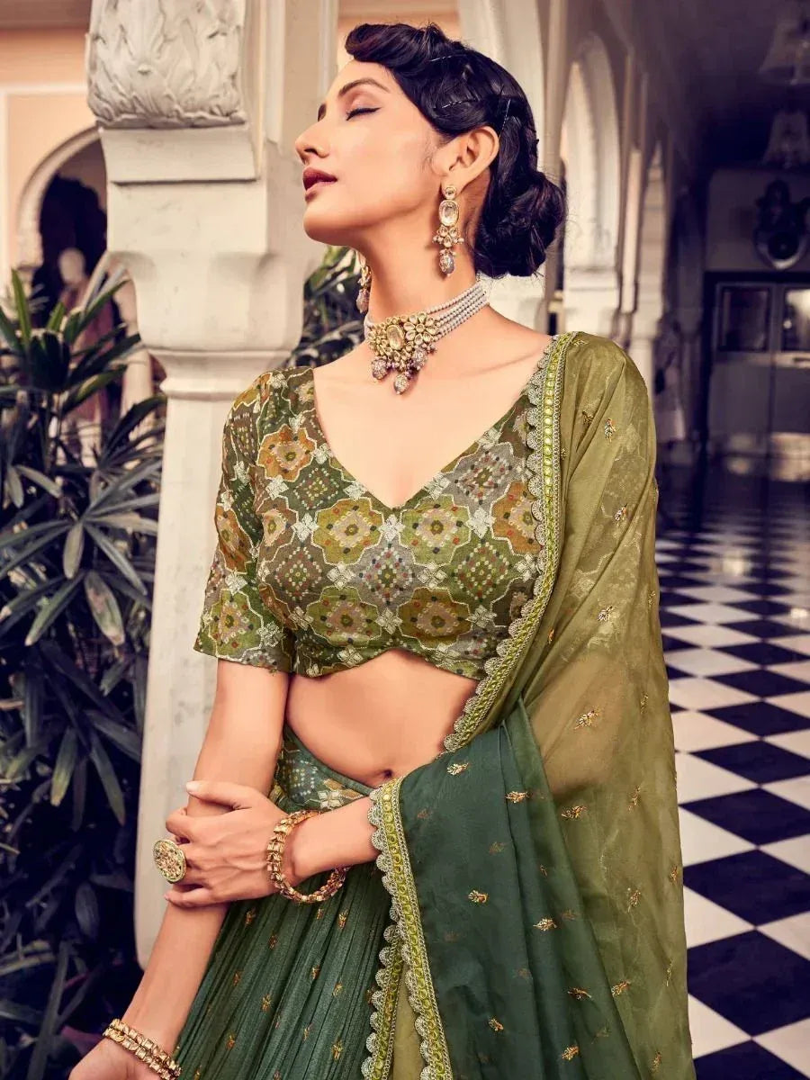 Elegant green embroidered lehenga choli with floral blouse, perfect for Indian ethnic occasions