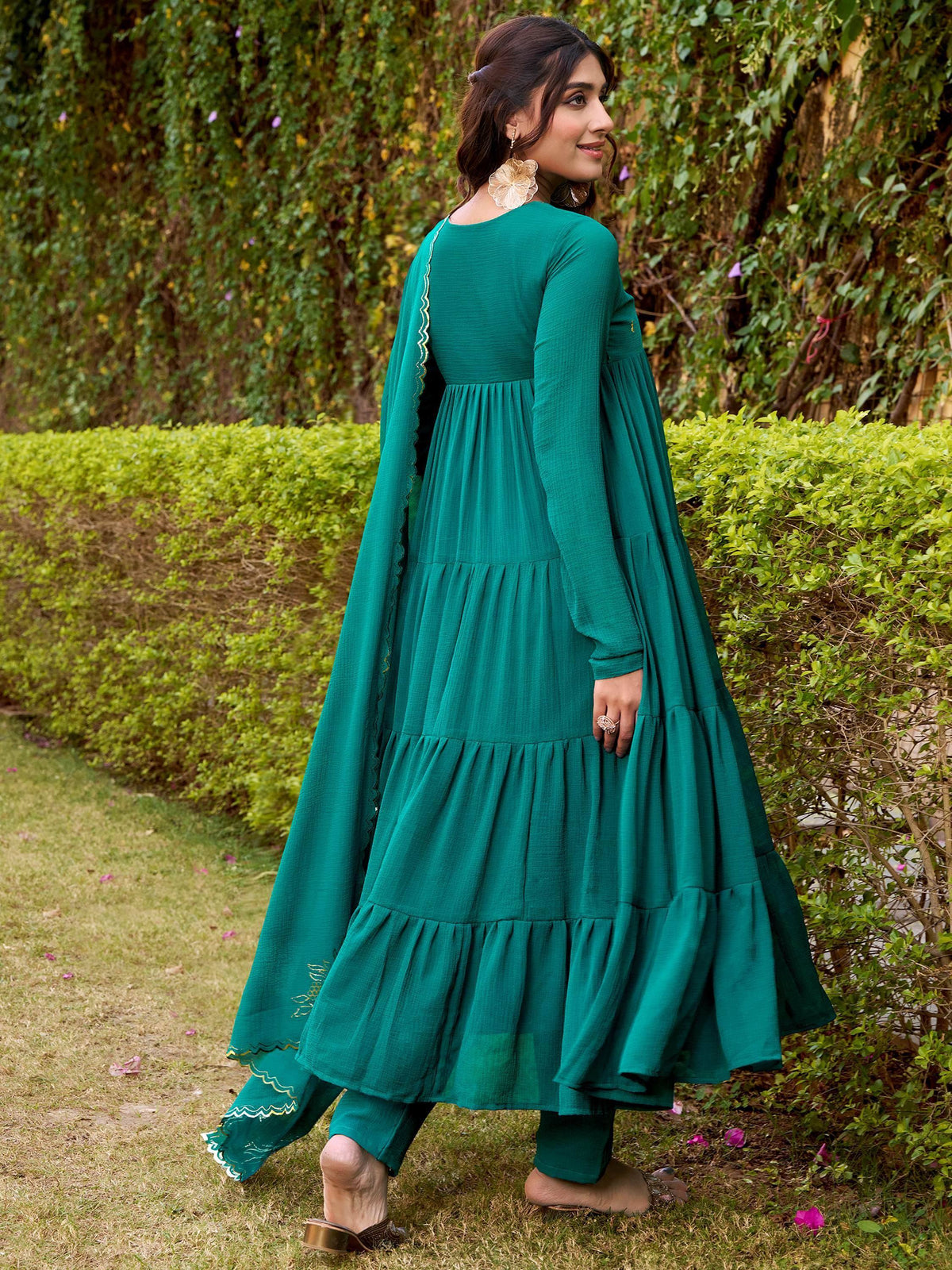 Emerald green tiered ethnic gown with scalloped dupatta, perfect for Indian occasions