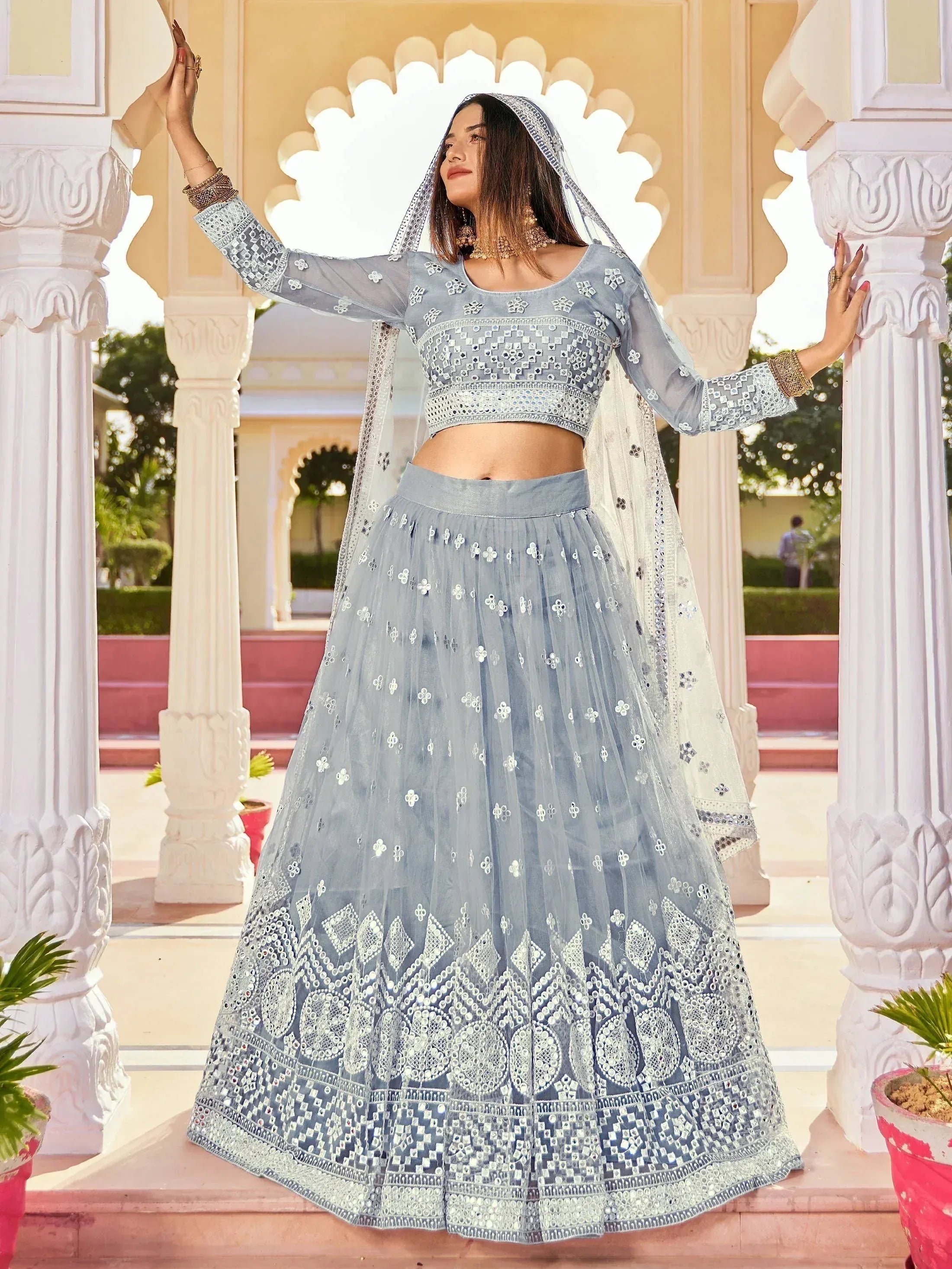 Light blue embroidered lehenga choli with mirror work, perfect for Indian ethnic wear events