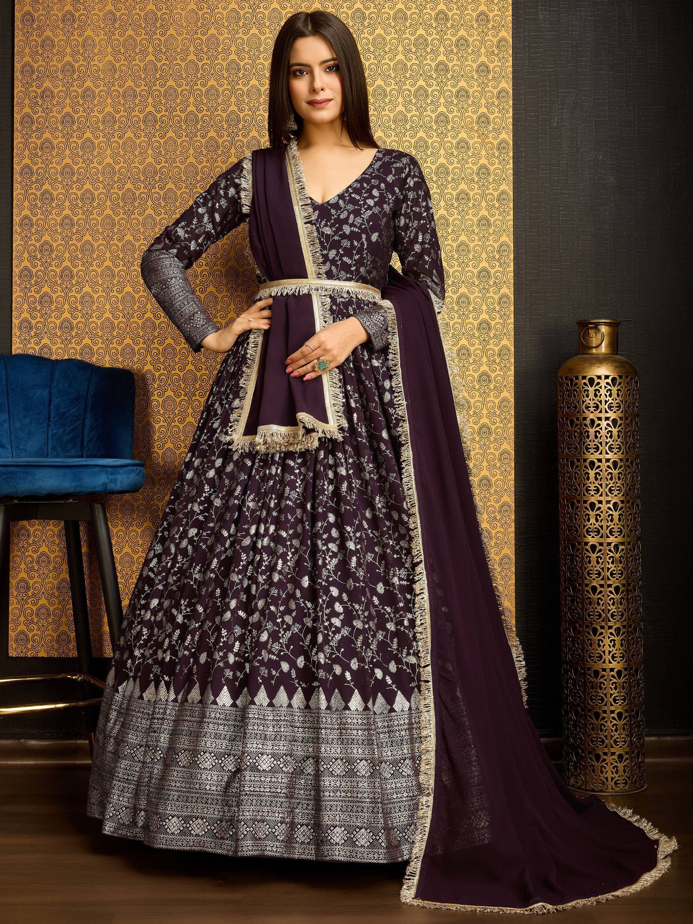 Woman in purple embroidered gown with dupatta, showcasing Indian ethnic wear fashion