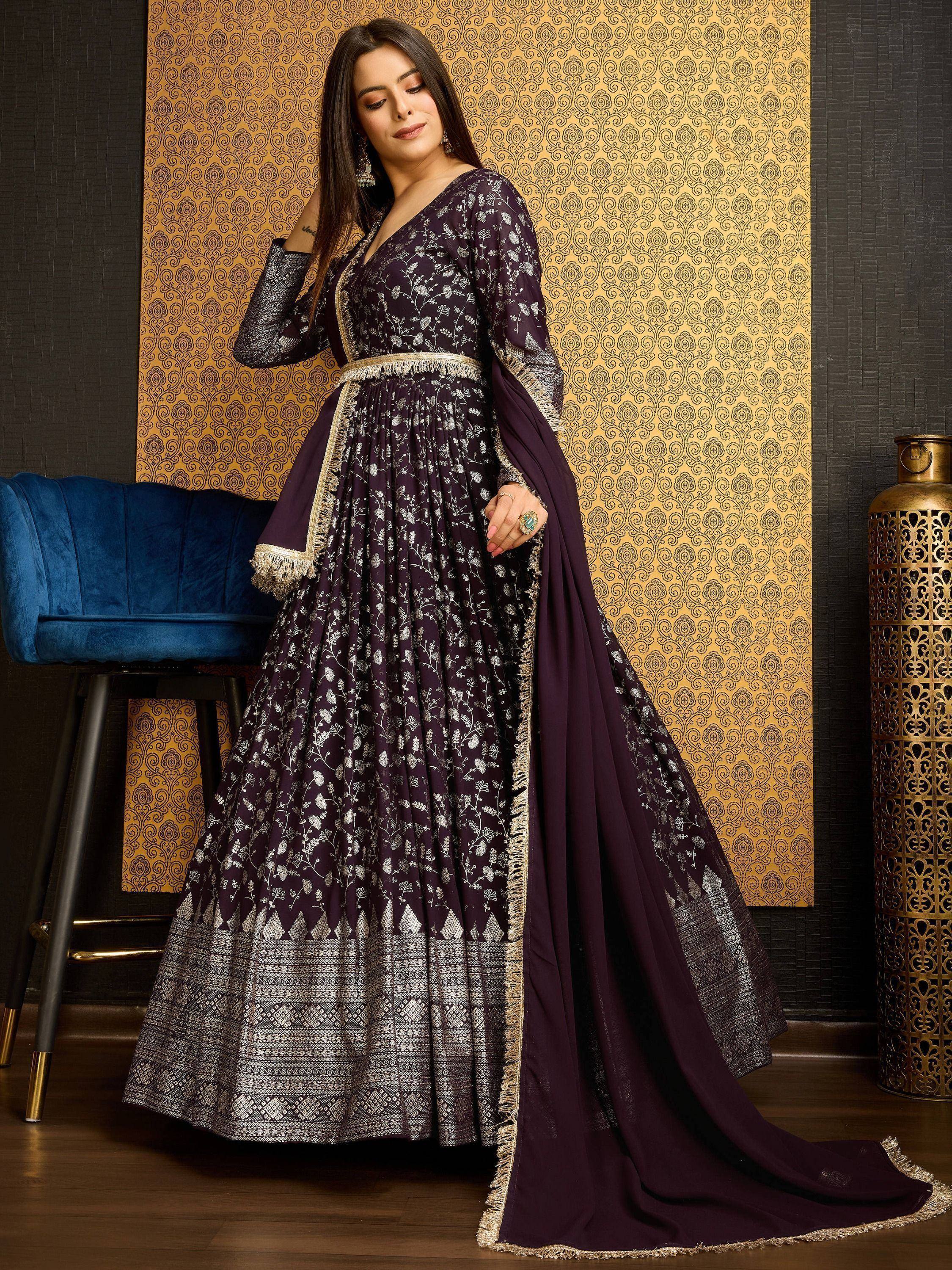 Woman in purple and silver ethnic gown with dupatta, floral pattern, traditional Indian attire