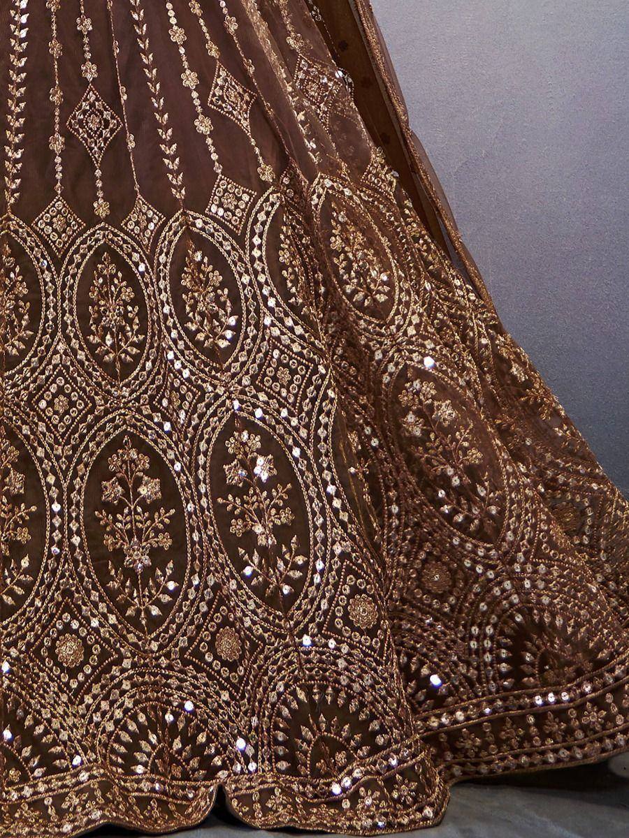 Brown designer lehenga with intricate gold embroidery and sequin work, perfect for Indian ethnic wear.