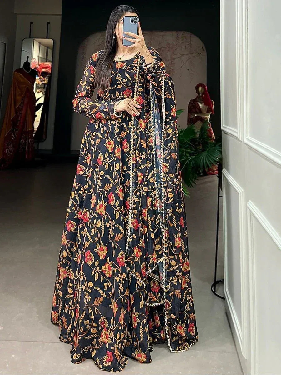 Black floral print ethnic gown with gold embroidery, perfect for Indian occasions and festive wear.