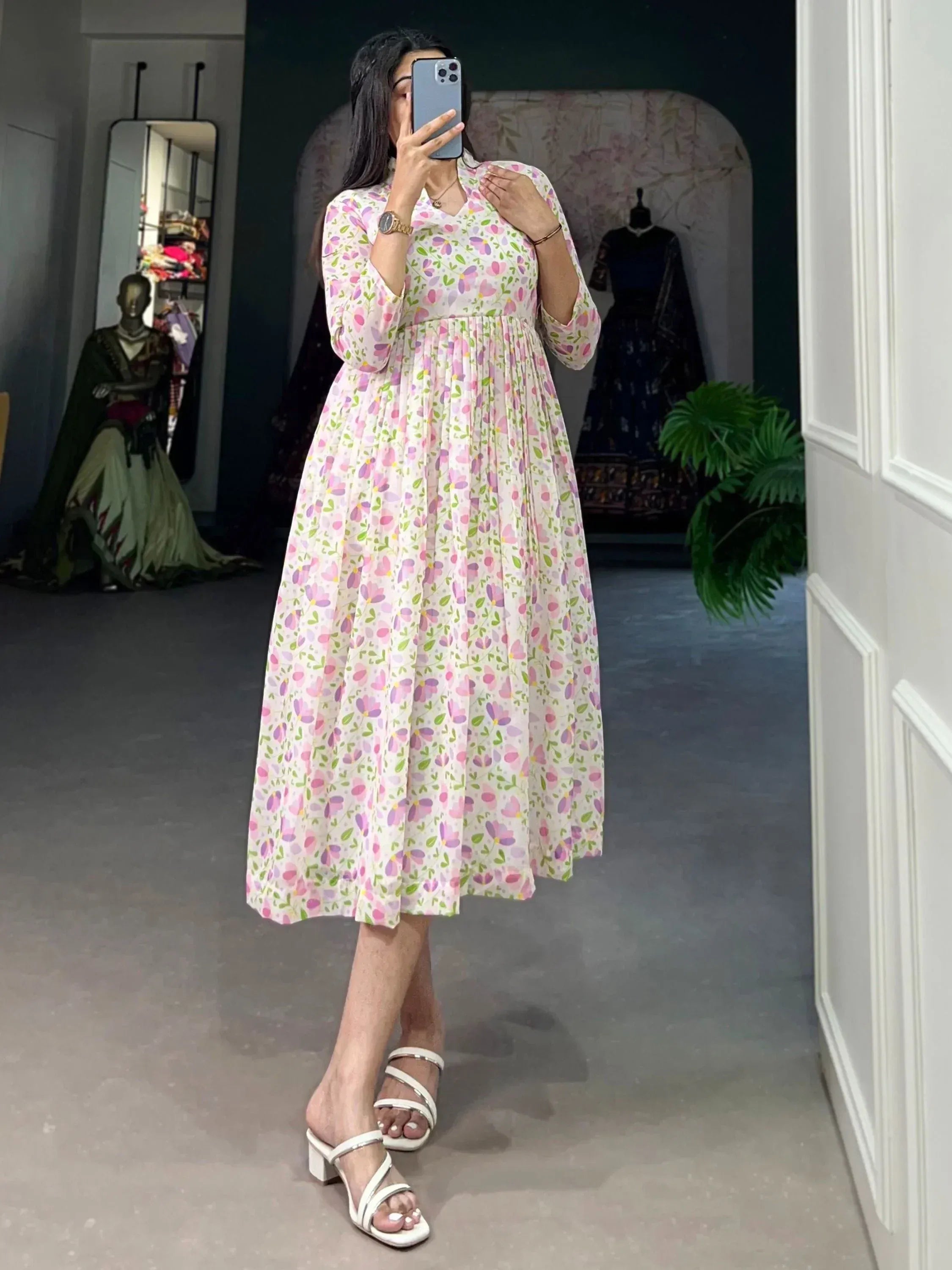 Floral print ethnic gown with V-neck and pleated skirt, perfect for Indian occasions