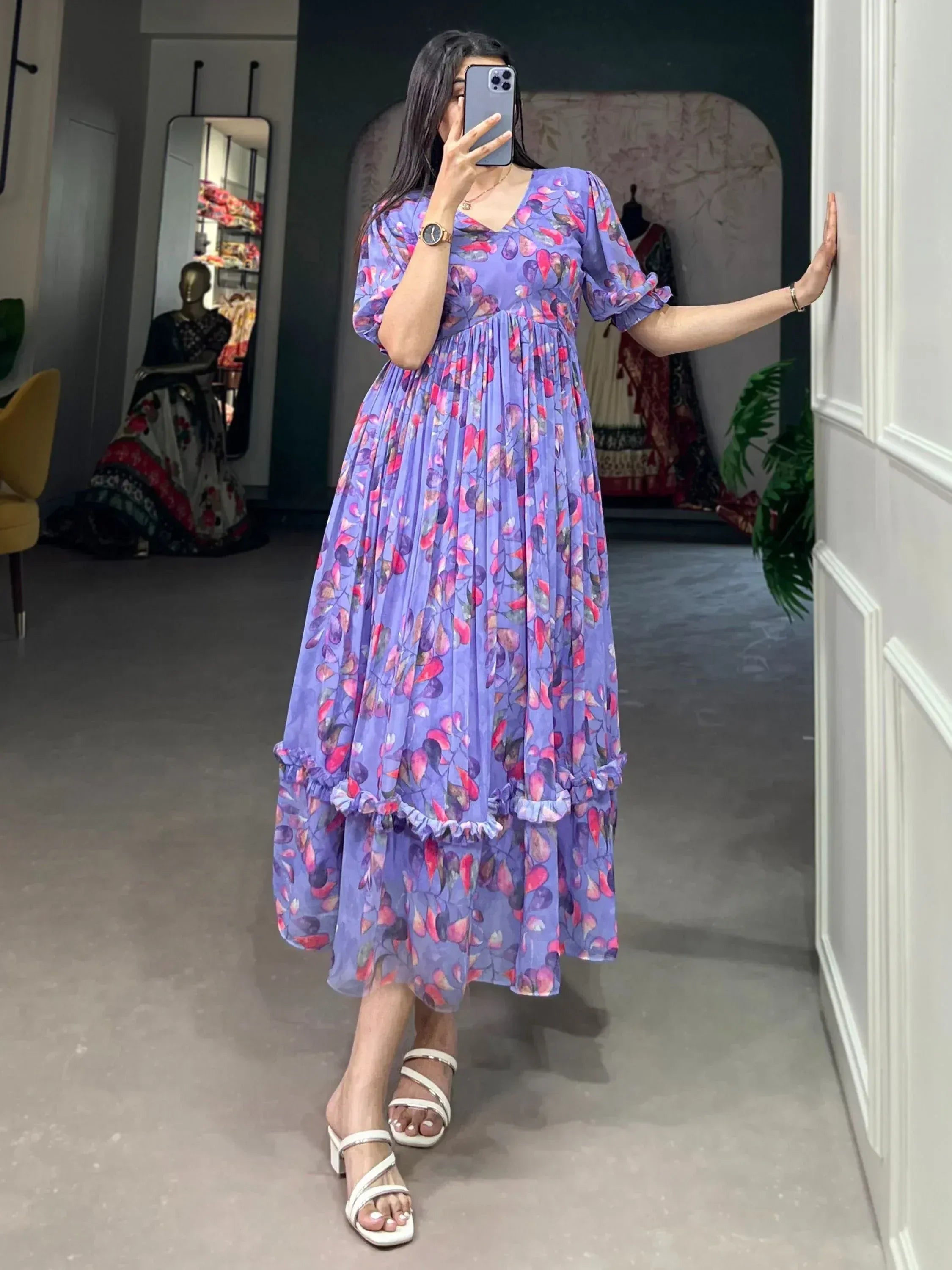 Purple floral ethnic gown with ruffled hem, perfect for Indian occasions and parties.