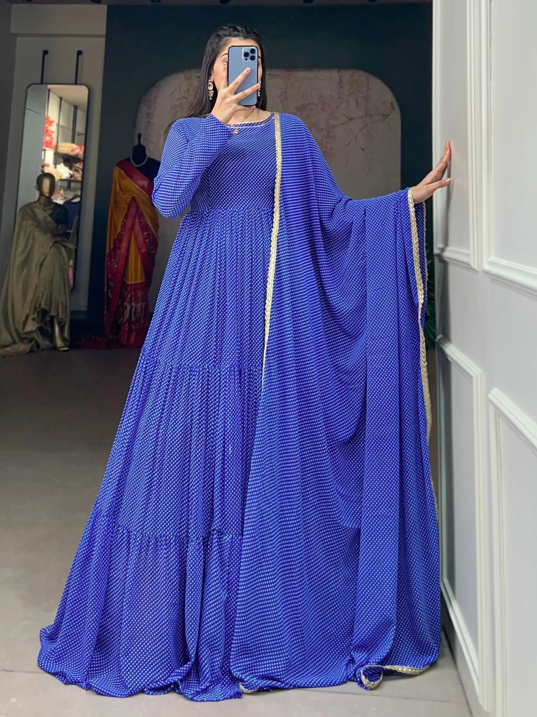 Royal blue ethnic gown with white polka dots and gold trim, perfect for Indian occasions