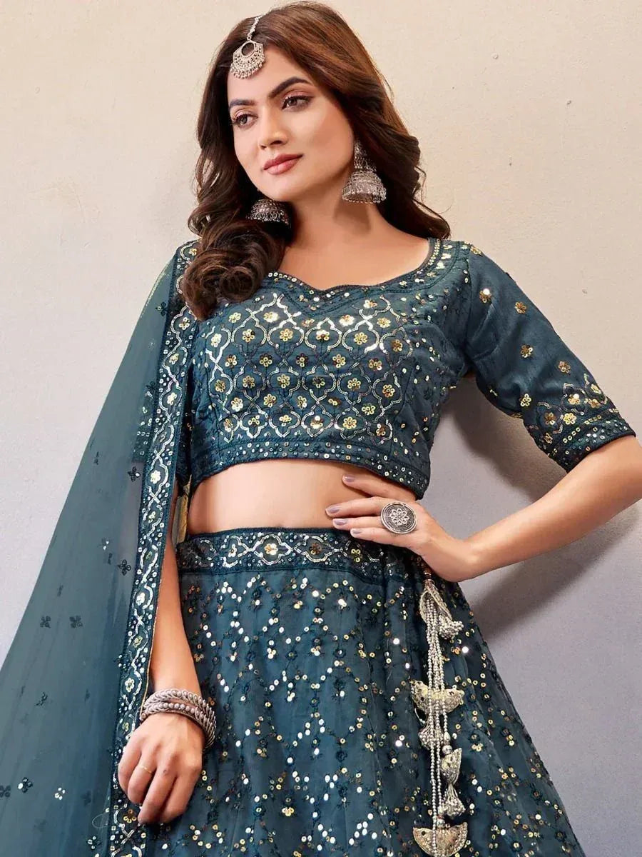 Teal embroidered lehenga choli with sequins, mirror work, and dupatta for Indian ethnic wear