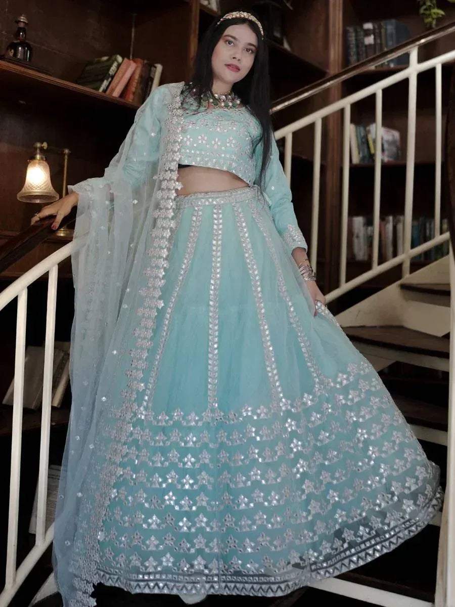 Mint green designer lehenga choli with silver mirror work, perfect for Indian ethnic wear occasions